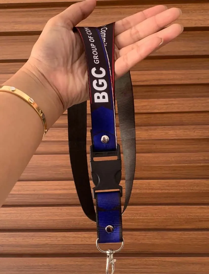 Printed company ID lanyard held in a hand